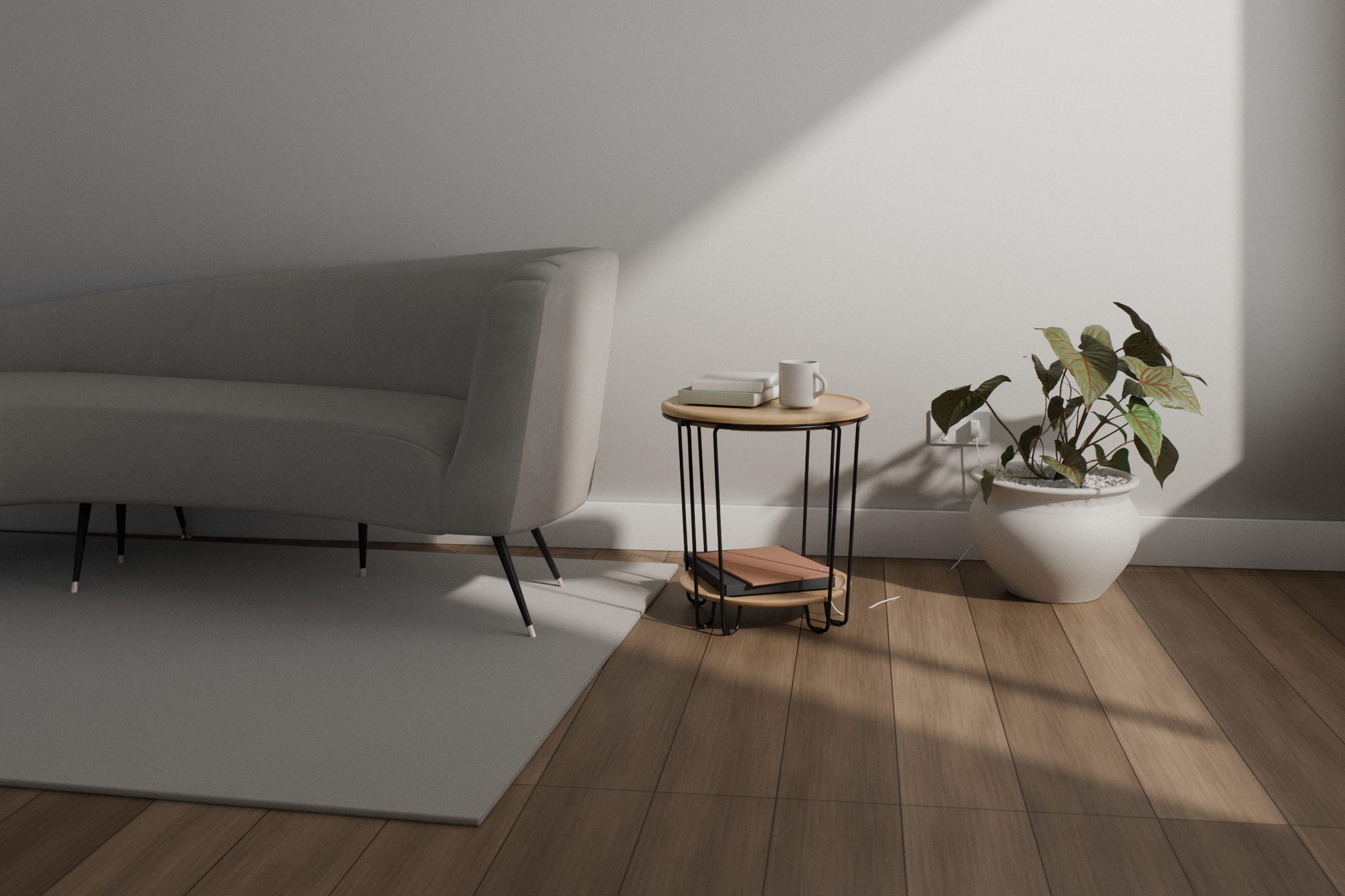 Wire side table in a sunlit living room beside a grey sofa and a potted plant, with a mug and books on the oak top and a phone charger plugged into the wall socket behind