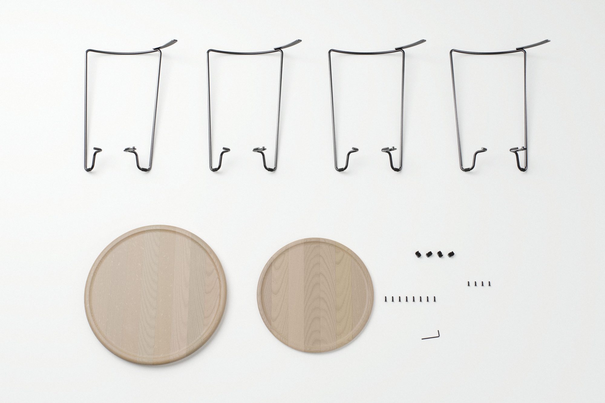 Kit of parts laid flat: four identical bent-wire frame pieces, oak top and shelf, saddles, screws and a hex key